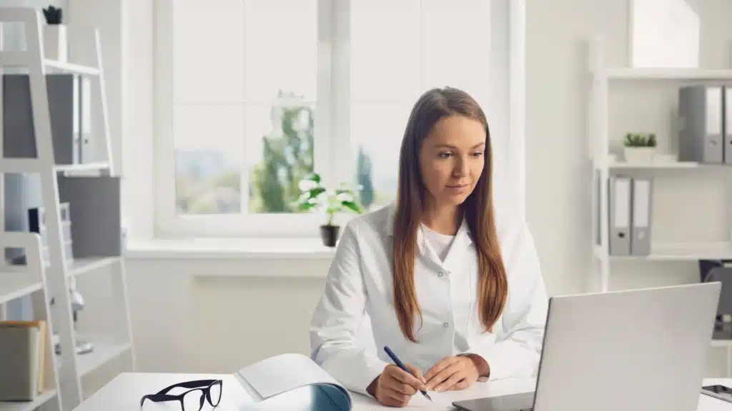 Plastic surgeon looking for marketing on computer