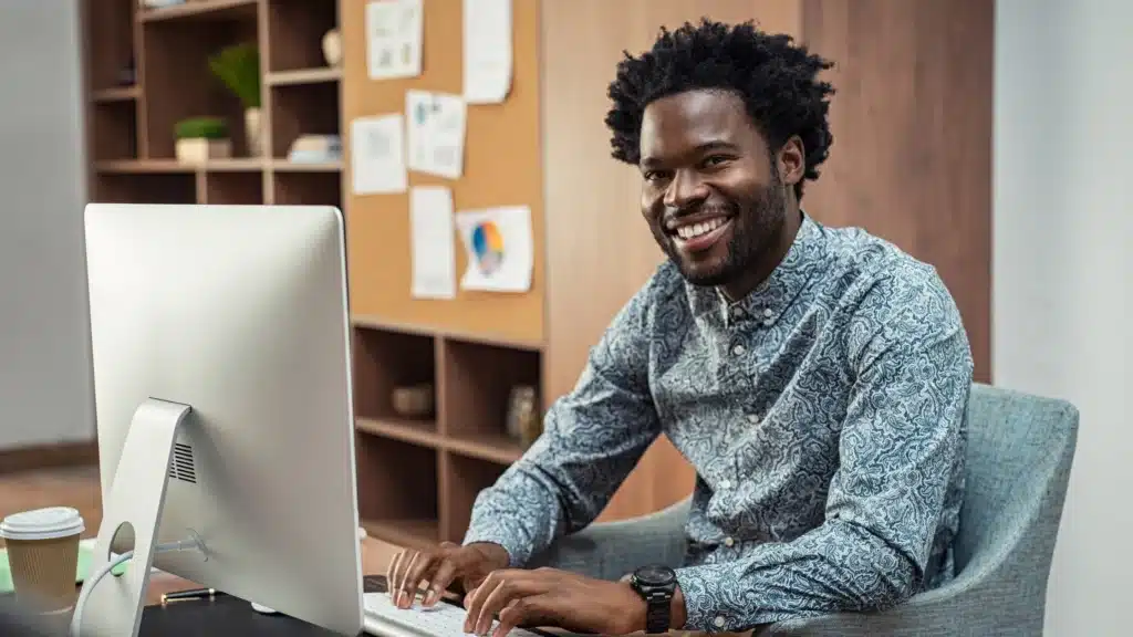 Marketing professional working at a computer, analyzing data for a healthcare-focused PPC campaign. Ideal for a blog covering PPC consultant strategies, Google Ads marketing agency tactics, and local SEO solutions tailored for elite healthcare brands.