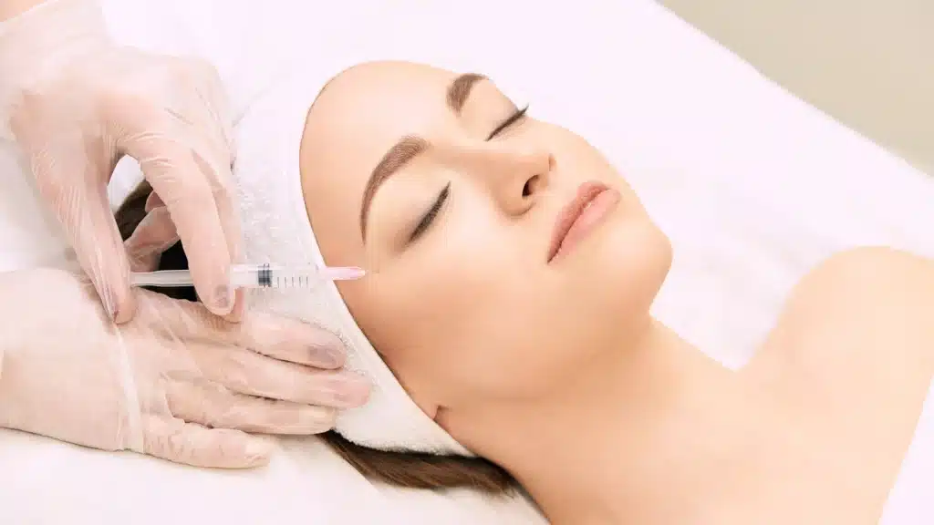 A woman getting Botox at a medspa, representing HIPAA compliance and patient privacy standards.